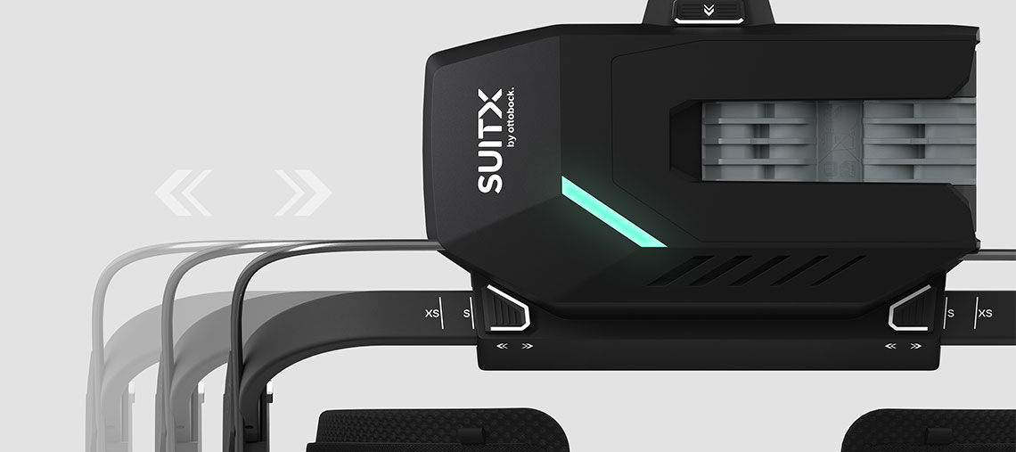 Ein schwarzer SUITX Werkzeugaufsatz mit grüner LED-Anzeige auf grauem Hintergrund.